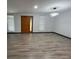 Open living room space with wood-look floors and natural lighting at 185 Glenrose Sw Cir, Atlanta, GA 30354