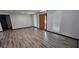 Bright living room with wood-look floors and a new wood front door at 185 Glenrose Sw Cir, Atlanta, GA 30354