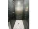 Modern tiled shower with hexagon tile shower floor at 185 Glenrose Sw Cir, Atlanta, GA 30354