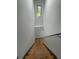 Stairwell featuring wooden steps, neutral walls, and a window for natural light at 185 Glenrose Sw Cir, Atlanta, GA 30354
