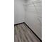 Bright walk-in closet featuring wood flooring and white wire shelving at 185 Glenrose Sw Cir, Atlanta, GA 30354