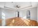 Airy bedroom boasting hardwood floors, trey ceiling, recessed lights, and multiple entryways at 3180 Tackett Rd, Douglasville, GA 30135