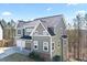Two-story home featuring neutral siding, a dark roof, white trim, and an attached two-car garage at 3180 Tackett Rd, Douglasville, GA 30135
