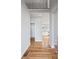 Bright foyer with hardwood floors, white walls and trim, and staircase in a modern home at 3180 Tackett Rd, Douglasville, GA 30135