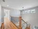 Bright hallway with wood floors and modern lighting, offering a glimpse into other rooms at 3180 Tackett Rd, Douglasville, GA 30135