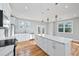 Bright kitchen features a granite island, stainless appliances, and an open dining area at 3180 Tackett Rd, Douglasville, GA 30135