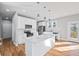 Bright kitchen with stainless steel appliances, a kitchen island, and access to the patio at 3180 Tackett Rd, Douglasville, GA 30135