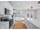 Modern kitchen with granite countertops, stainless steel appliances, and stylish pendant lighting at 3180 Tackett Rd, Douglasville, GA 30135