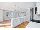 Spacious kitchen with a granite island, hardwood floors, recessed lighting, and stainless appliances at 3180 Tackett Rd, Douglasville, GA 30135