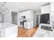 Bright kitchen with white cabinets, stainless steel appliances, an island, and granite countertops at 3180 Tackett Rd, Douglasville, GA 30135