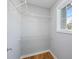 Walk-in closet features wire shelving, base trim, and a window to let in natural light at 3180 Tackett Rd, Douglasville, GA 30135