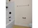 Clean bathroom with a white shower, bronze hardware, and tile flooring at 3570 Terrasol Sw Trl, Lilburn, GA 30047