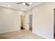 A carpeted bedroom with neutral walls features a walk-in closet with a white door at 3570 Terrasol Sw Trl, Lilburn, GA 30047