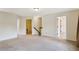 A spacious, carpeted bonus room with natural light features an open floorplan at 3570 Terrasol Sw Trl, Lilburn, GA 30047