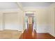 Inviting entryway featuring hardwood floors, decorative molding, and neutral wall colors at 3570 Terrasol Sw Trl, Lilburn, GA 30047