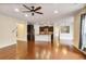 Open-concept living area with hardwood floors, seamlessly connecting the kitchen and living spaces at 3570 Terrasol Sw Trl, Lilburn, GA 30047