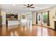 Spacious living room showcases an open floor plan, hardwood floors, and connects to the kitchen at 3570 Terrasol Sw Trl, Lilburn, GA 30047
