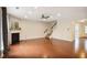 Cozy living room with hardwood floors, a fireplace, and a staircase, perfect for gatherings at 3570 Terrasol Sw Trl, Lilburn, GA 30047