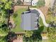 Aerial view of the home and its meticulously landscaped surroundings, including a driveway and lush greenery at 1395 Oconee Ne Pass, Brookhaven, GA 30319