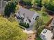 Overhead view of modern home in lush neighborhood, showing the surrounding landscape and driveway at 1395 Oconee Ne Pass, Brookhaven, GA 30319