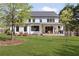 Spacious backyard view of the modern farmhouse with a covered patio perfect for outdoor living and entertaining at 1395 Oconee Ne Pass, Brookhaven, GA 30319