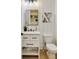Elegant powder room with a white vanity, stylish fixtures, and modern shiplap walls at 1395 Oconee Ne Pass, Brookhaven, GA 30319
