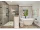 Spa-like bathroom with a walk-in shower, soaking tub, and elegant finishes at 1395 Oconee Ne Pass, Brookhaven, GA 30319