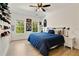 Spacious bedroom with bright windows, featuring a cozy bed and unique baseball cap decor at 1395 Oconee Ne Pass, Brookhaven, GA 30319