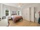Light-filled bedroom with built-in wardrobes, a cozy bed, and a modern desk area at 1395 Oconee Ne Pass, Brookhaven, GA 30319