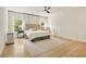 Spacious primary bedroom with large windows, hardwood floors, and a neutral color palette at 1395 Oconee Ne Pass, Brookhaven, GA 30319