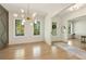 Bright dining room with hardwood floors, large windows, a statement chandelier, and modern decor at 1395 Oconee Ne Pass, Brookhaven, GA 30319