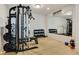 Well-equipped home gym with weight machine, dumbbells, and motivational wall decor at 1395 Oconee Ne Pass, Brookhaven, GA 30319