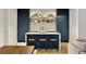 Modern kitchen featuring a blue island with white countertop, gold accents and shelving at 1395 Oconee Ne Pass, Brookhaven, GA 30319