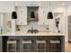 Stylish kitchen featuring quartz countertops, an island with seating, and stainless steel appliances and white cabinetry at 1395 Oconee Ne Pass, Brookhaven, GA 30319