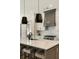 Modern kitchen featuring quartz countertops, an island with seating, and stainless steel appliances at 1395 Oconee Ne Pass, Brookhaven, GA 30319