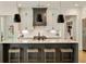 Stylish kitchen featuring quartz countertops, an island with seating, and stainless steel appliances and white cabinetry at 1395 Oconee Ne Pass, Brookhaven, GA 30319