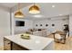 Open concept living space with kitchen island, dining area and a large sectional sofa at 1395 Oconee Ne Pass, Brookhaven, GA 30319