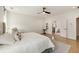 Bright main bedroom with a king bed, hardwood floors, and an ensuite bathroom at 1395 Oconee Ne Pass, Brookhaven, GA 30319