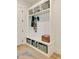 Mudroom with custom built-in bench, storage cubbies, and coat hooks, offering a practical entryway solution at 1395 Oconee Ne Pass, Brookhaven, GA 30319