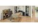 Spacious home office with hardwood floors, stylish desk, built-in shelving, and an area rug at 1395 Oconee Ne Pass, Brookhaven, GA 30319