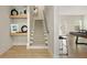 Neutral carpet covers the staircase with decorative shelving in a brightly lit modern home at 1395 Oconee Ne Pass, Brookhaven, GA 30319
