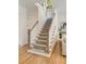 Inviting foyer with a carpeted staircase, hardwood flooring, and natural light at 1395 Oconee Ne Pass, Brookhaven, GA 30319