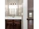 Cozy bathroom features dark vanity and tile backsplash at 2375 Walker Dr, Hampton, GA 30228