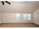 Spacious bedroom with neutral carpet, vaulted ceiling, and large windows at 2375 Walker Dr, Hampton, GA 30228
