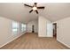 Spacious bedroom with neutral walls, plush carpet, and ceiling fan at 2375 Walker Dr, Hampton, GA 30228