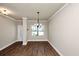 Open dining room featuring wood floors and an elegant chandelier at 2375 Walker Dr, Hampton, GA 30228
