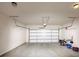Clean garage space with a large white garage door and overhead lighting at 2375 Walker Dr, Hampton, GA 30228