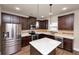 Charming kitchen features stainless steel appliances and ample counter space at 2375 Walker Dr, Hampton, GA 30228