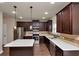 Well-equipped kitchen with stainless steel appliances, an island and ample cabinetry at 2375 Walker Dr, Hampton, GA 30228