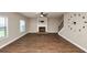 Spacious living room features hardwood floors, fireplace, ceiling fan and staircase at 2375 Walker Dr, Hampton, GA 30228